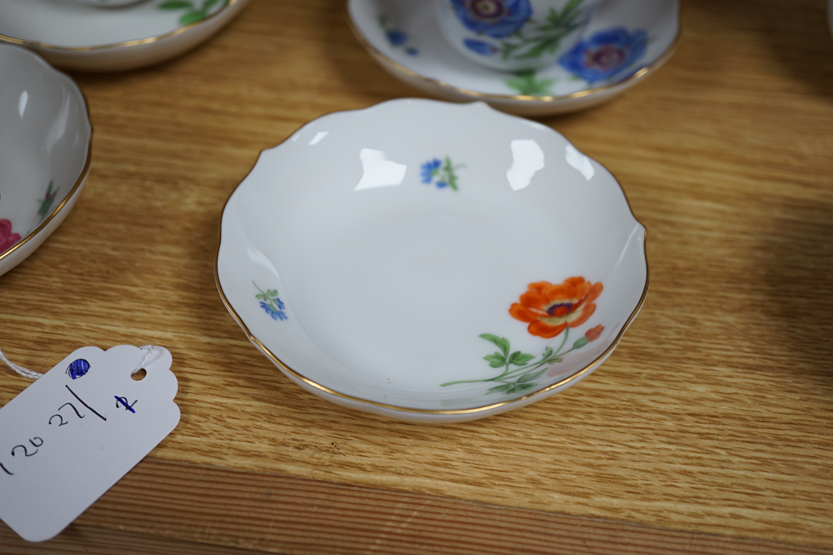 A 20th century Meissen coffee set with floral decoration, comprising a coffee pot, a milk jug, a lidded sugar bowl, and six cups and saucers, coffee pot, 17cm high